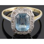 A blue gem and diamond set cluster ring