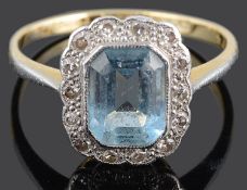 A blue gem and diamond set cluster ring