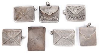 Six Edwardian silver stamp envelopes