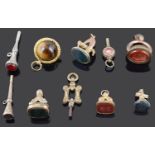 A collection of 19th Century watch keys and pendant fobs
