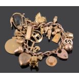 A heavy 9ct rose gold curb link charm bracelet