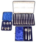 A set of twelve George V silver handled pistol grip butter knives