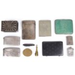 A late Victorian William Comyns silver match box cover, silver card cases and other items