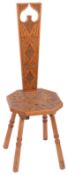 An Arts and Crafts Welsh carved satin walnut spinning chair