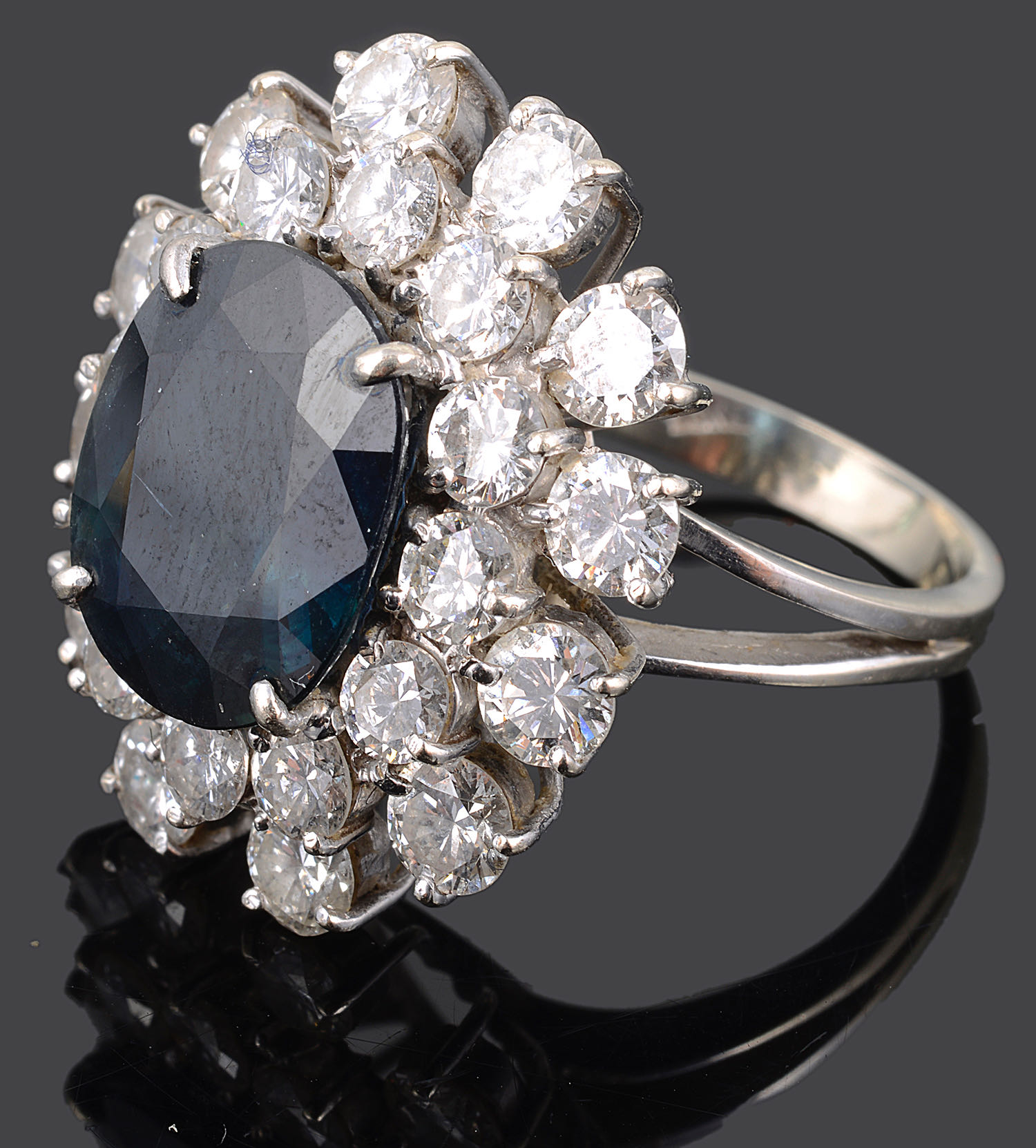 A large Continental sapphire and diamond set cluster ring