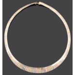 A continental 14K tri-colour gold articulated fringe necklace