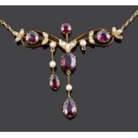 A delicate Edwardian garnet and seed pearl set scroll necklace