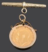 A George V gold half sovereign 1911 in a 9ct gold pendant mount