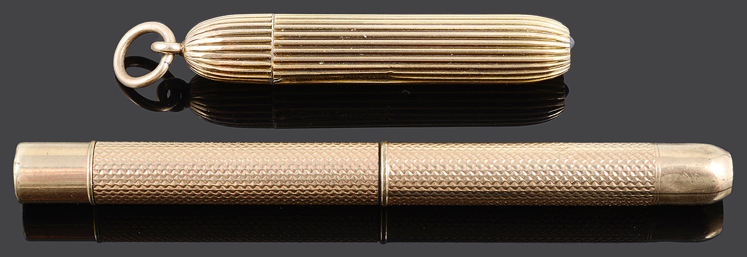 Two yellow metal propelling pencils