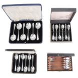 Three cased sets of silver spoons