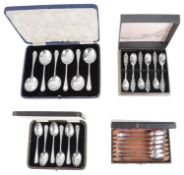 Three cased sets of silver spoons