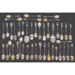 A collection of mostly early 20th century continental silver and silver gilt souvenir teaspoons