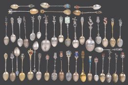 A collection of mostly early 20th century continental silver and silver gilt souvenir teaspoons