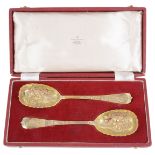 A pair of late Victorian silver gilt berry spoons
