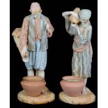 A pair of Royal Worcester porcelain figures of water carriers, c1894 and 1895 (2)