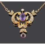 An Art Nouveau amethyst and seed pearl set scroll pendant necklace