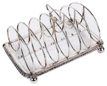 A George IV silver seven bar toast rack