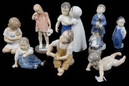 Nine mostly Royal Copenhagen porcelain figures