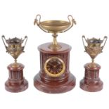 A late 19th century French three piece red marble and gilt metal clock garniture (3)