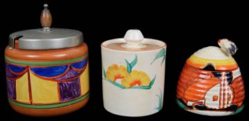 A Clarice Cliff Bizarre Farmhouse pattern beehive preserve jar and cover; others (3)