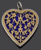 An attractive gold overlaid Islamic heart shaped glass pendant