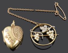 A delicate Edwardian 15ct gold and platinum grape vine brooch and a diamond set heart locket