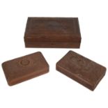 An early 20th century Indian Kasmiri carved wood table cigar box and two smaller cigarette boxes(3)