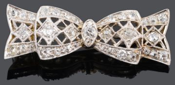 An attractive small Art Deco diamond set ribbon brooch