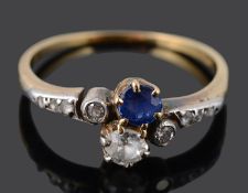 A delicate Edwardian sapphire and diamond set cross over ring