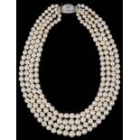 An impressive four row cultured pearl necklace with diamond set clasp