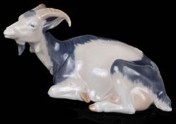 A Royal Copenhagen porcelain figure of a recumbent goat No 466.