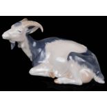 A Royal Copenhagen porcelain figure of a recumbent goat No 466.