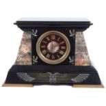 A late 19th Century French Egyptian Revival black slate and rouge mantel clock