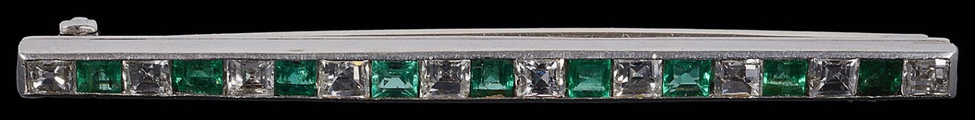 A good quality Art Deco emerald and diamond set line brooch