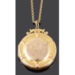 An early 20th Century circular picture locket on chain