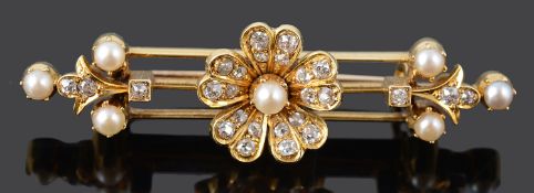 A charming late Victorian/early Edwardian diamond and pearl daisy cluster triple bar brooch