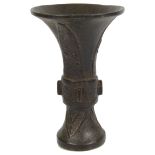 A Chinese archaic bronze gu shaped vase