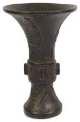 A Chinese archaic bronze gu shaped vase