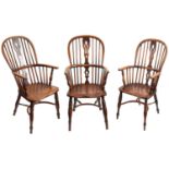 A harlequin set of six early 19th century ash and elm hoop back Windsor armchairs (6)