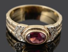 A contemporary 9ct gold flat cut pink gem and diamond dress ring
