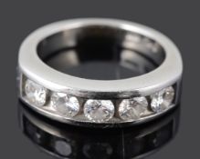 A contemporary five stone channel set diamond half eternity ring