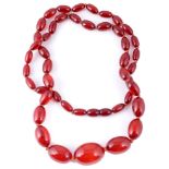 A single row necklace of graduated cherry amber beads