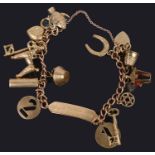 A delicate 9ct gold curb link charm identity bracelet