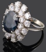 A large Continental sapphire and diamond set cluster ring