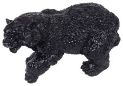 A black painted cast iron doorstop in form of a walking bear