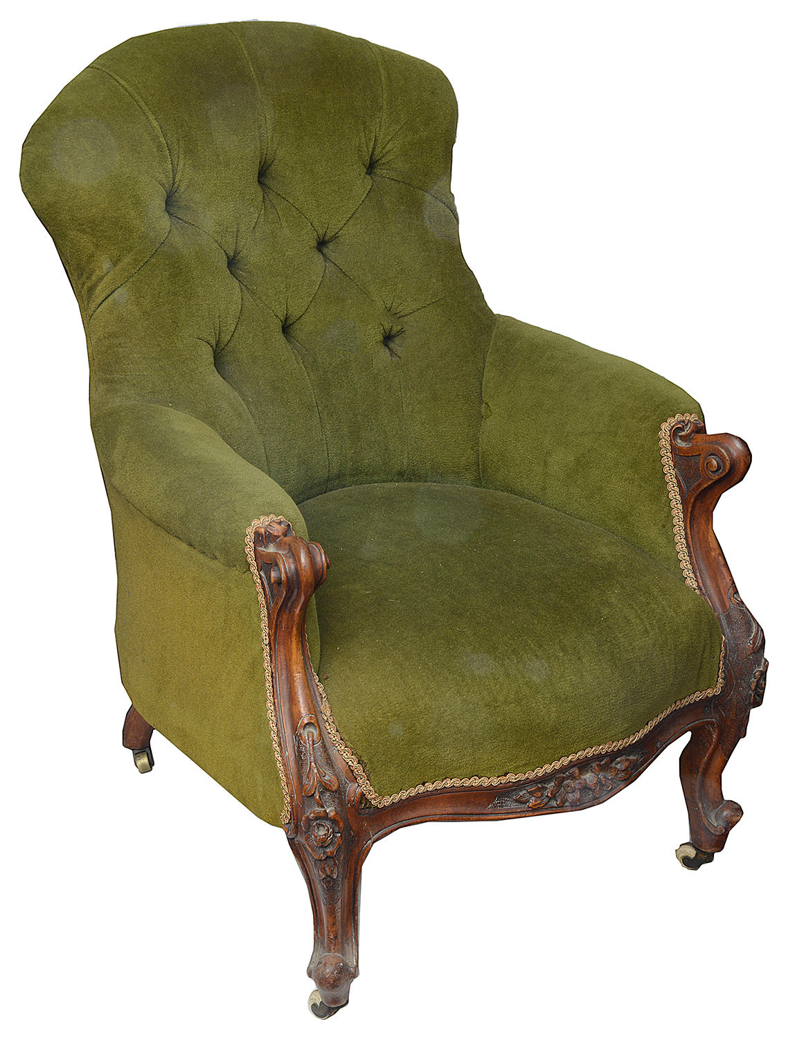 A Victorian buttonback upholstered walnut framed armchair