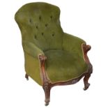 A Victorian buttonback upholstered walnut framed armchair