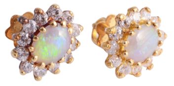 A pair of opal and diamond set cluster earrings