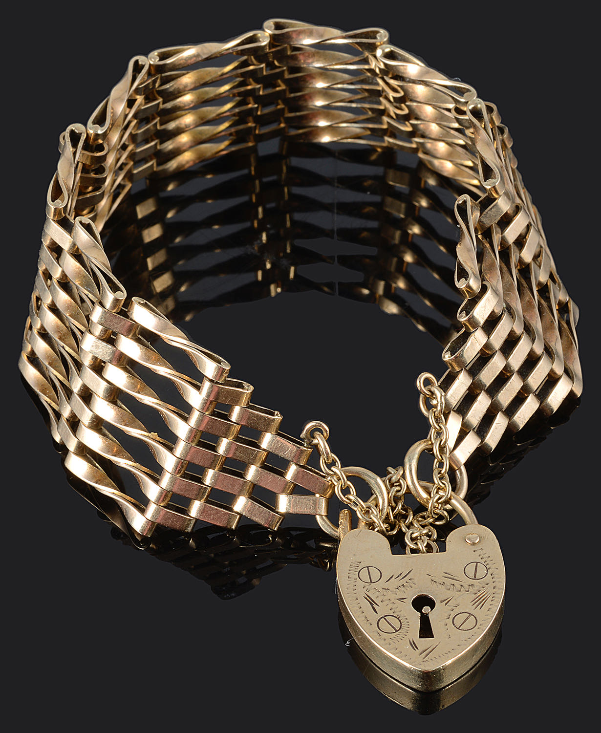 A contemporary 9ct gold six bar gate bracelet