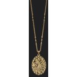 A contemporary Continental gold phoenix pendant on chain